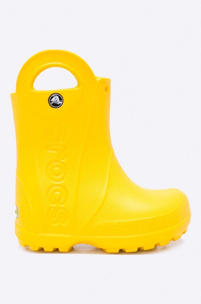 Crocs - Дитячі гумові чоботи Handle Rain колір жовтий