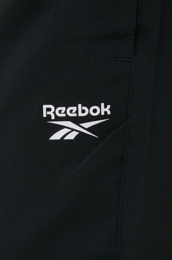 Штани для тренувань Reebok Essentials FP9170 чоловічі колір чорний фото 4