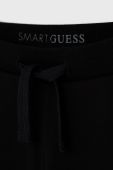 Дитячі штани Guess колір чорний гладке (1534764)