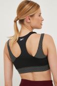Бюстгальтер для йоги Reebok Studio Layered колір чорний візерунок