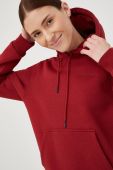 Кофта Peak Performance жіноча колір бордовий з капюшоном однотонна
