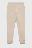 Дитячі спортивні штани Guess колір бежевий меланж