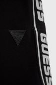 Дитячі спортивні штани Guess колір чорний з аплікацією (2420931)