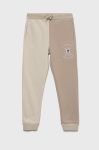 Дитячі спортивні штани Tommy Hilfiger колір бежевий з аплікацією Дитячі спортивні штани Tommy Hilfiger колір бежевий з аплікацією