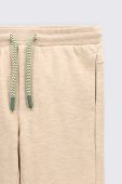 Штани для немовлят Coccodrillo колір бежевий однотонні