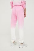 Бавовняні спортивні штани Guess жіночі колір рожевий з принтом