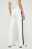 Спортивні штани Fila жіночі колір бежевий з аплікацією