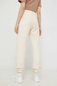 Спортивні штани Champion жіночі колір бежевий з аплікацією