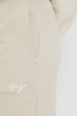 Бавовняні спортивні штани HUGO жіночі колір бежевий однотонні