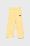 Дитячі спортивні штани Guess колір жовтий однотонні