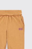 Дитячі спортивні штани Coccodrillo колір бежевий однотонні (2552976)