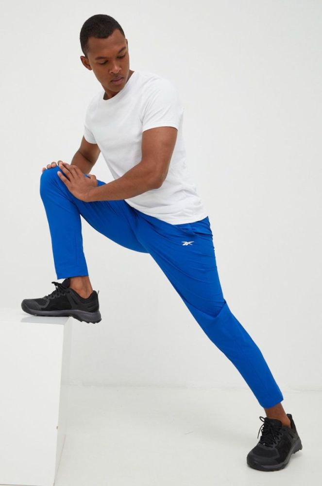 Спортивні штани Reebok чоловічі однотонні колір блакитний фото 2