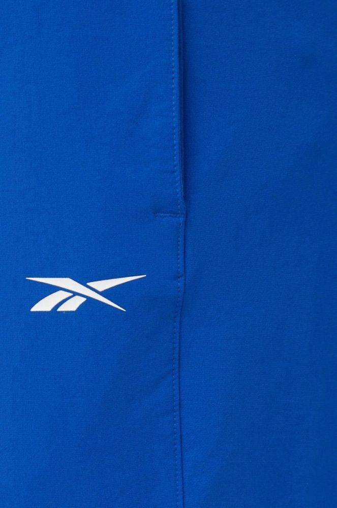 Спортивні штани Reebok чоловічі однотонні колір блакитний фото 4
