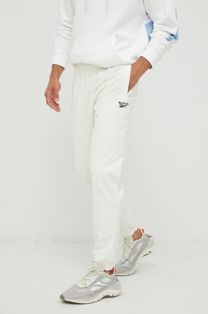 Спортивні штани Reebok Classic чоловічі колір бежевий з принтом