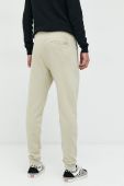 Бавовняні спортивні штани Superdry чоловічі колір бежевий з аплікацією