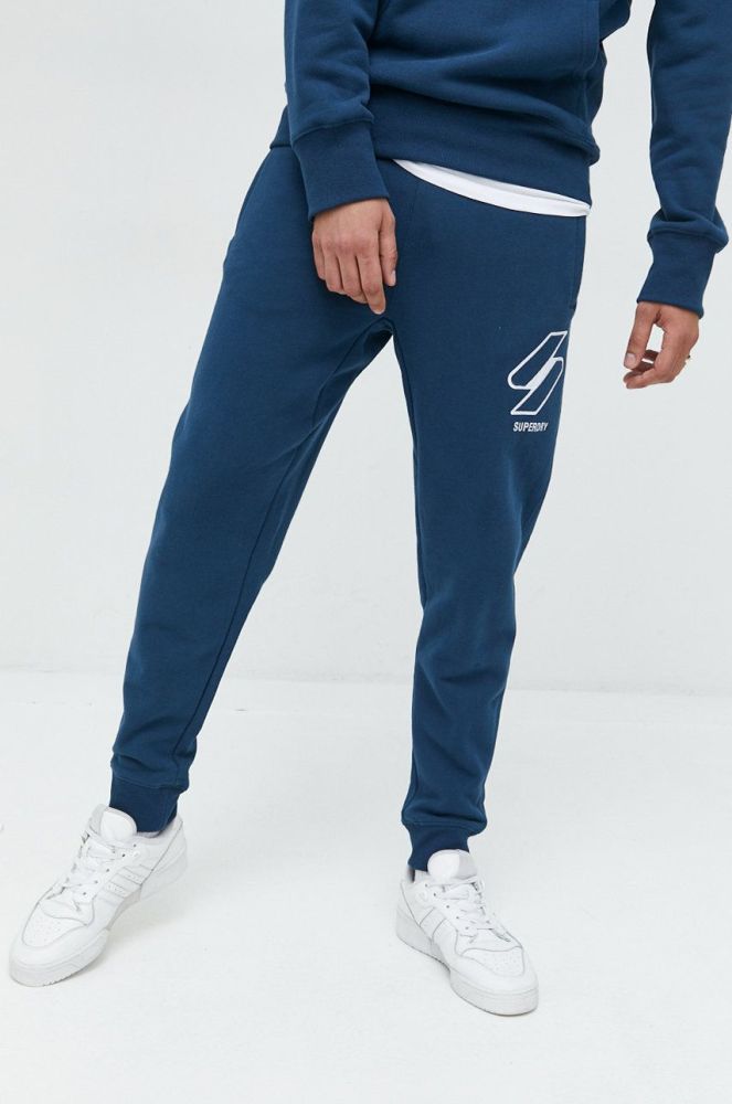 Бавовняні спортивні штани Superdry чоловічі з аплікацією колір блакитний
