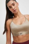 Спортивний бюстгальтер Reebok Lux колір бежевий однотонний Спортивний бюстгальтер Reebok Lux колір бежевий однотонний