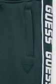 Дитячі спортивні штани Guess колір зелений з принтом