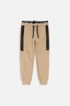 Дитячі бавовняні штани Coccodrillo колір бежевий візерунок (3474522) Дитячі бавовняні штани Coccodrillo колір бежевий візерунок (3474522)