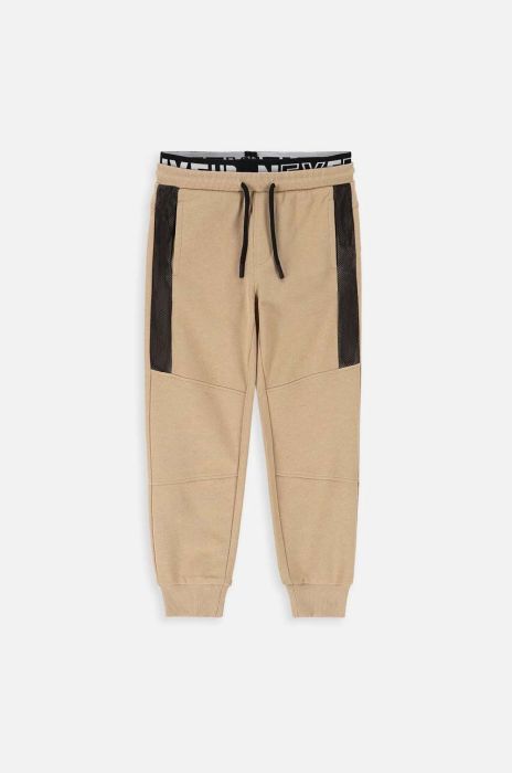 Дитячі бавовняні штани Coccodrillo колір бежевий візерунок (3474522)