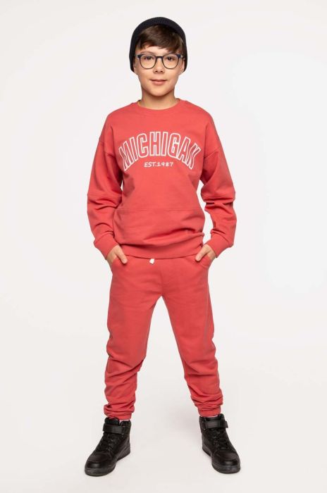 Дитячі бавовняні штани Coccodrillo колір бордовий однотонні (3495632)