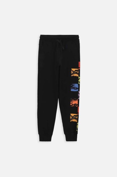 Дитячі бавовняні штани Coccodrillo ZC3120101ASJ колір чорний з принтом