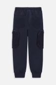 Дитячі бавовняні штани Coccodrillo колір синій з принтом