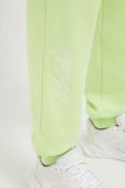 Бавовняні штани adidas колір зелений однотонні