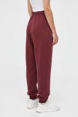 Бавовняні спортивні штани Reebok Classic колір бордовий однотонні