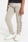 Дитячі спортивні штани Guess колір бежевий візерунок (3404417)