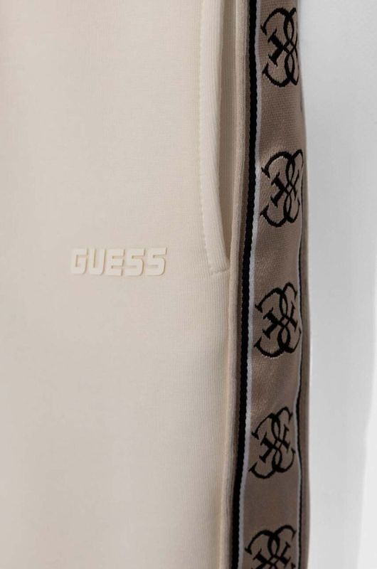 Дитячі спортивні штани Guess колір бежевий фото 4