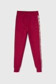 Дитячі спортивні штани Guess колір бордовий візерунок