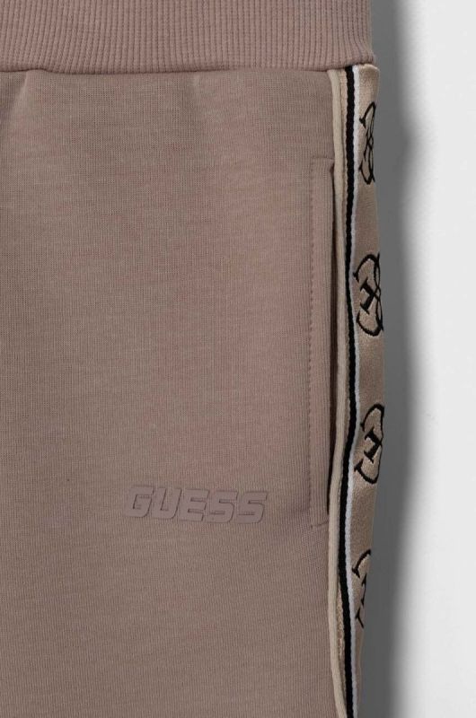 Дитячі спортивні штани Guess колір коричневий фото 3