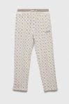 Дитячі штани Guess колір бежевий візерунок