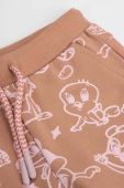 Дитячі спортивні штани Coccodrillo x Looney Tunes колір коричневий візерунок