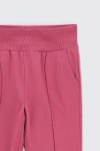Дитячі бавовняні штани Coccodrillo колір рожевий однотонні (3642243)