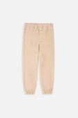 Дитячі бавовняні штани Coccodrillo колір бежевий однотонні (3477834)
