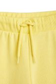 Дитячі бавовняні штани Mini Rodini колір жовтий з принтом