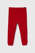 Дитячі бавовняні штани United Colors of Benetton колір червоний меланж