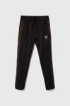 Дитячі спортивні штани Guess колір чорний з аплікацією (3603018)