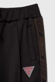 Дитячі спортивні штани Guess колір чорний з аплікацією (3603018)
