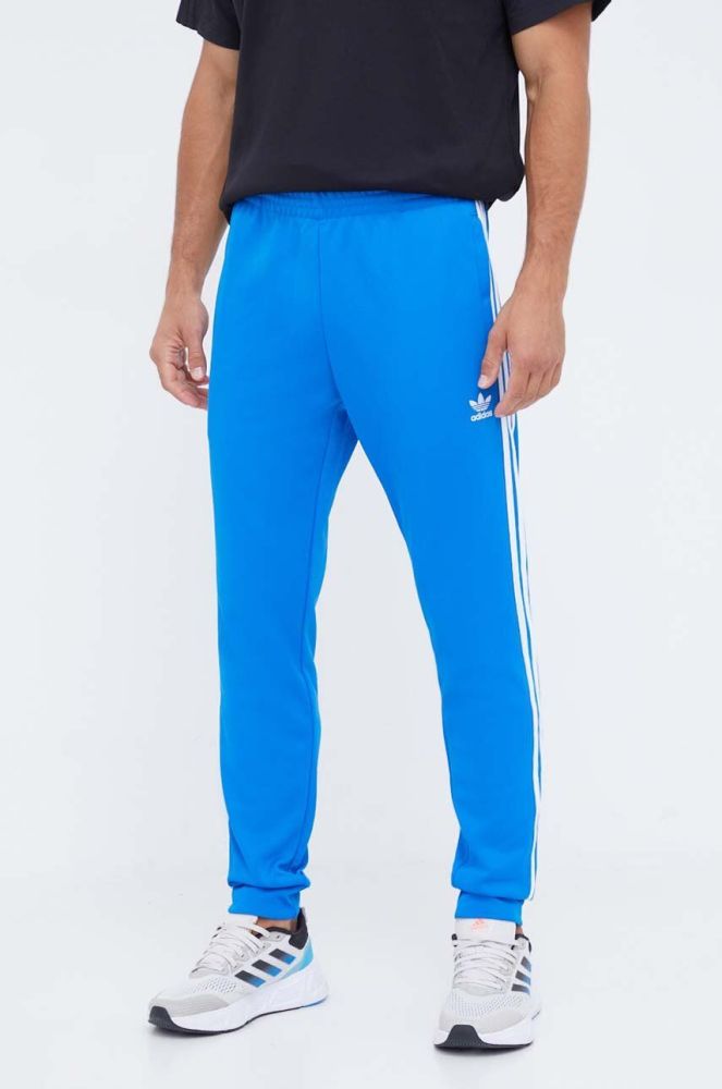 Спортивні штани adidas Originals з аплікацією колір блакитний (3508143)