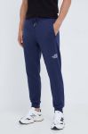 Бавовняні спортивні штани The North Face колір синій однотонні