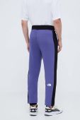 Бавовняні спортивні штани The North Face колір фіолетовий візерунок