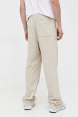 Бавовняні спортивні штани Tommy Jeans колір бежевий однотонні