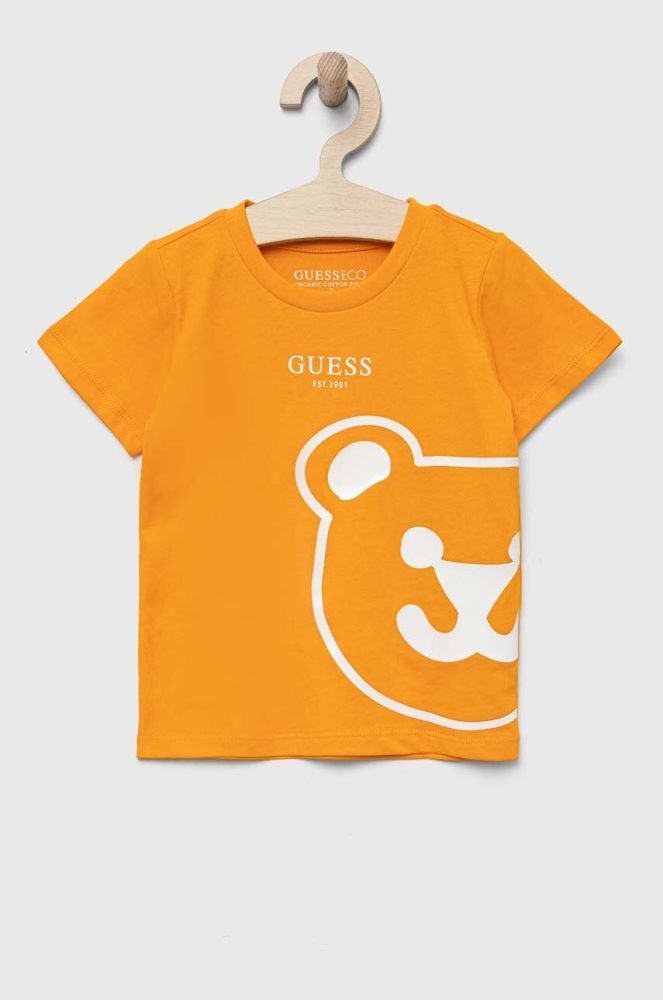 Дитяча бавовняна футболка Guess колір помаранчевий з принтом (3328692)