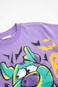 Дитяча бавовняна футболка Coccodrillo x Scooby Doo колір фіолетовий з принтом