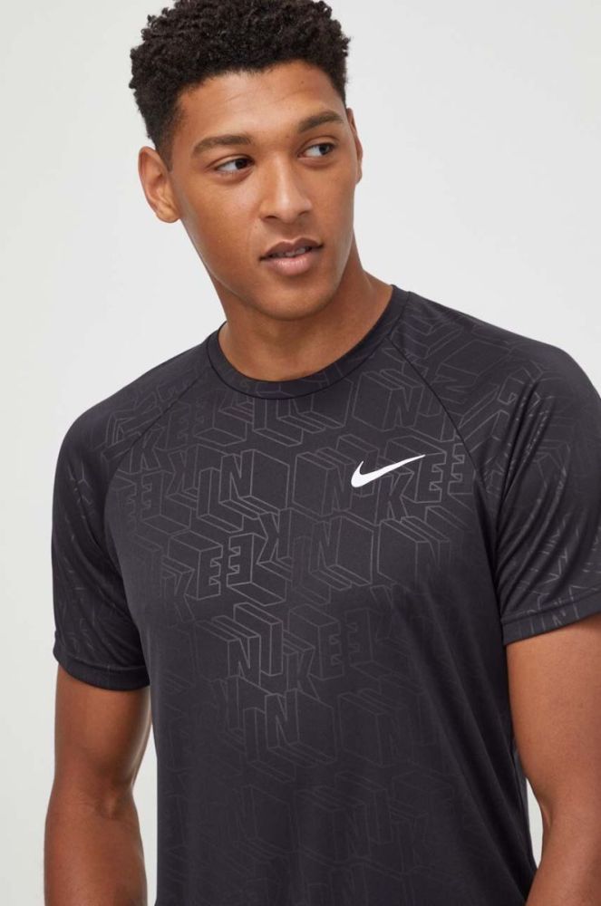 Тренувальна футболка Nike колір чорний візерунок фото 3