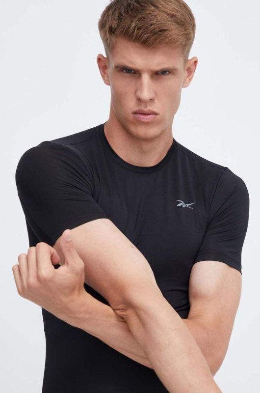 Тренувальна футболка Reebok Compression колір чорний однотонна