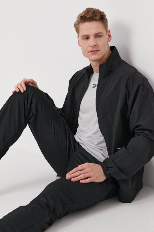 Штани Reebok FP9120 чоловічі колір чорний гладке фото 2